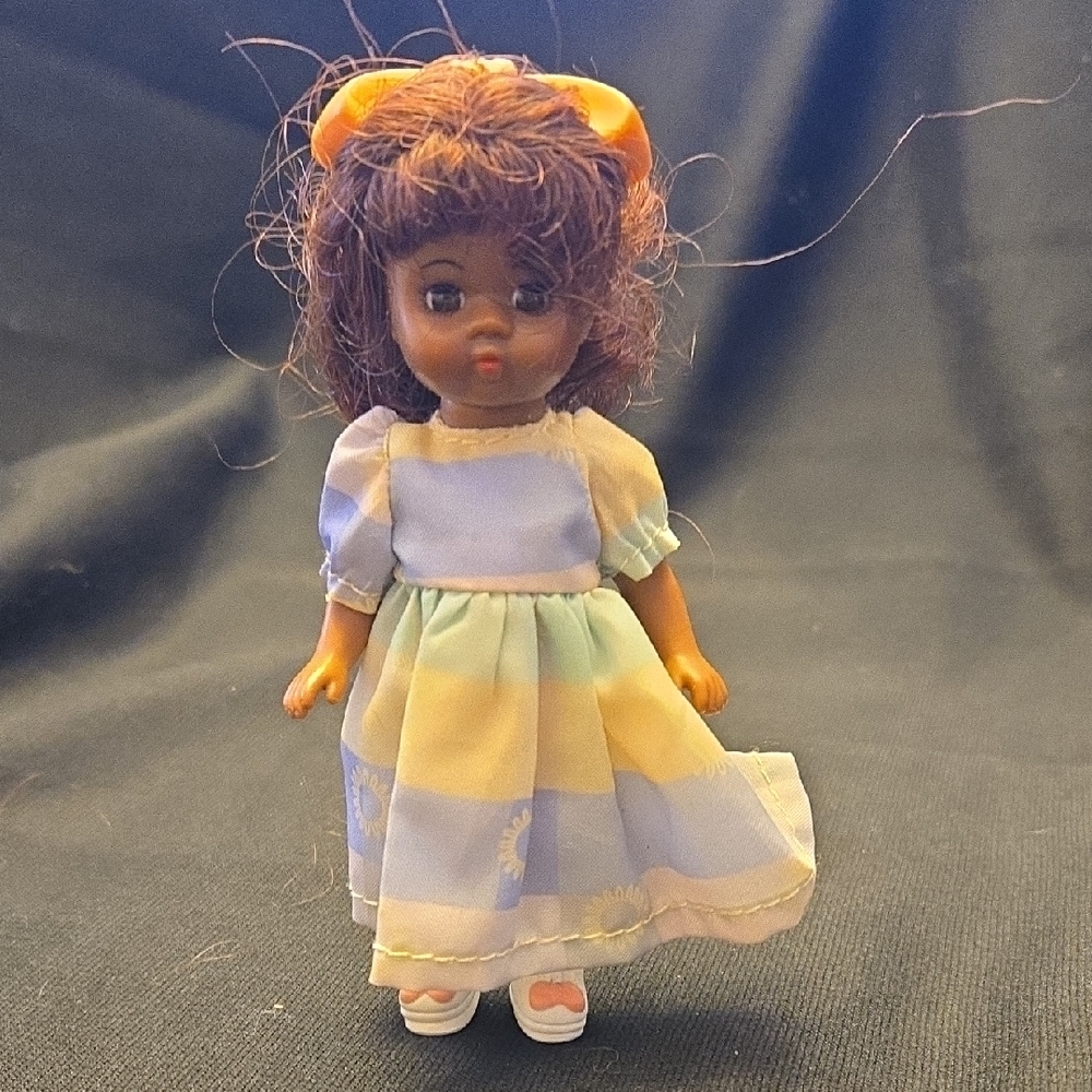 Madame Alexander Black Doll with Pastel Dress and Orange Bow